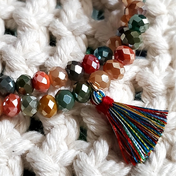 Crystal rondelle beaded double stretch bracelet with tassel charm. 6mm beads. - Picture 2 of 4